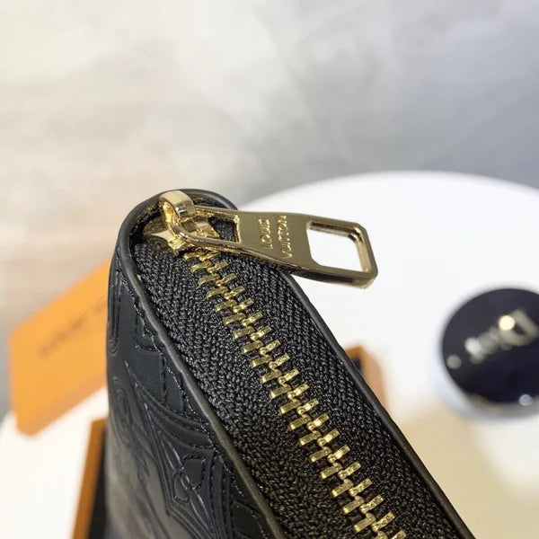 Louis Vuitton Wallet Made of Leather Embossed with the Brand's Logo