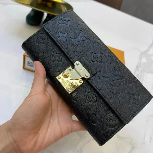 Louis Vuitton Slender Wallet – Monogram Seal Embossed Cowhide